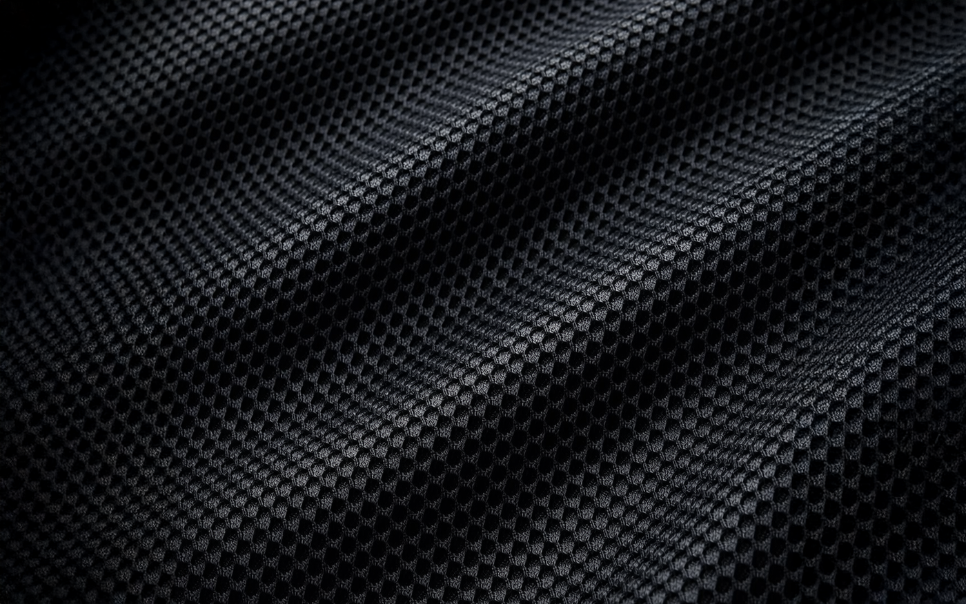 Poly-mesh sweat-wicking lining at impact areas